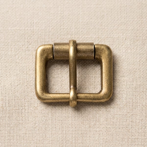 Antique brass square roller buckle on linen